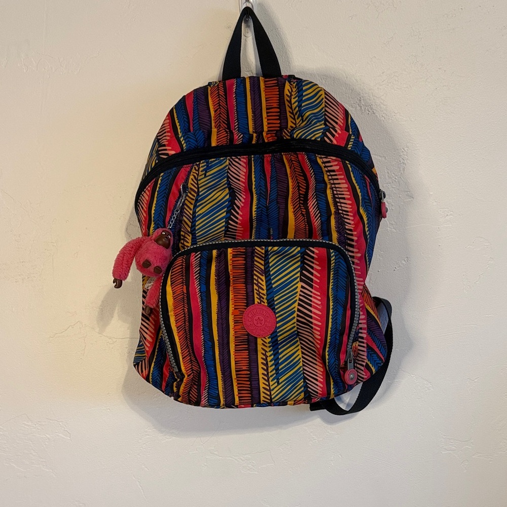 Kipling Colorful Striped Backpack with Pink Charm